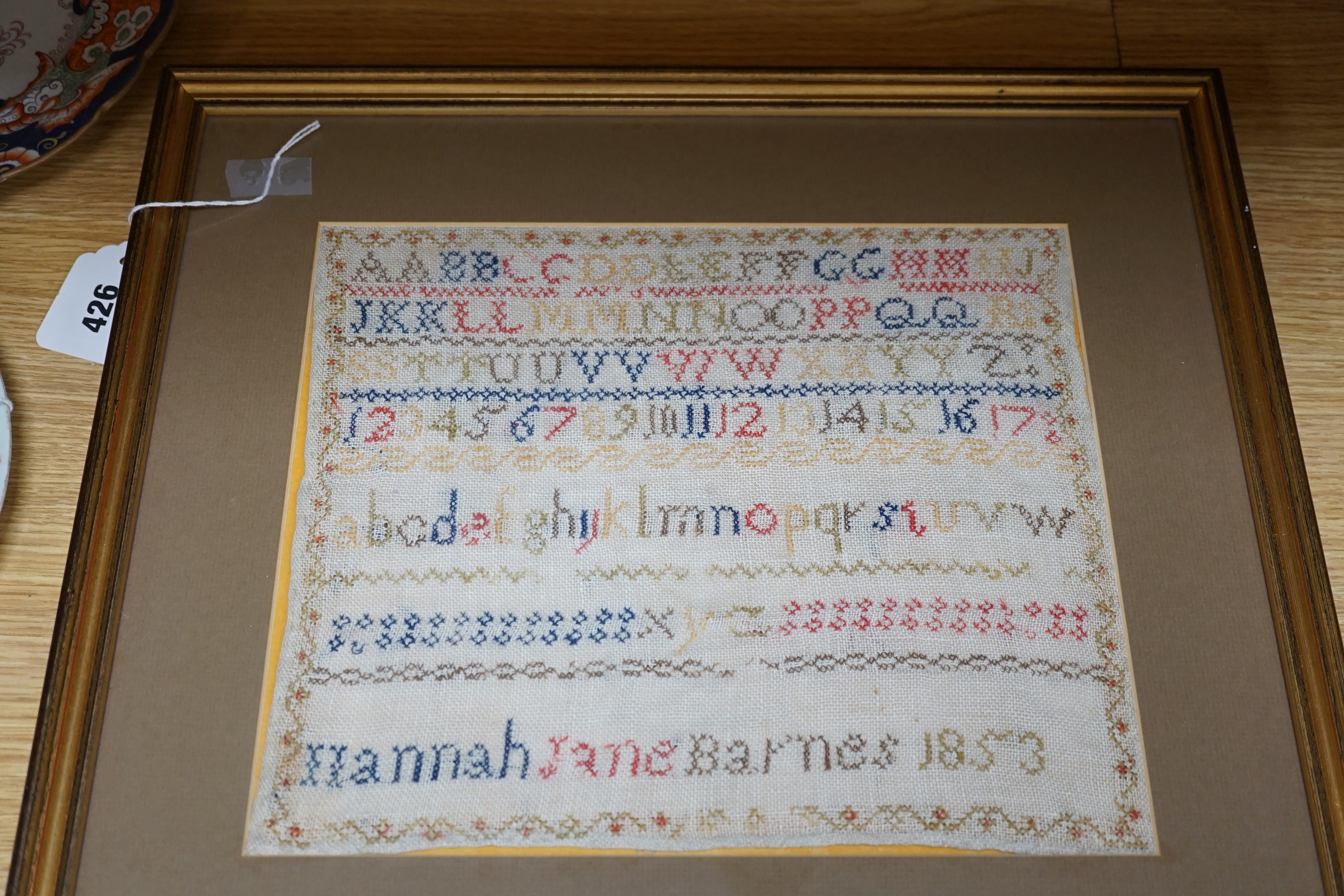 Two Victorian alphabet samplers worked by Emma and Hannah Barnes, one dated 1853, framed as one, overall 73 x 44cm